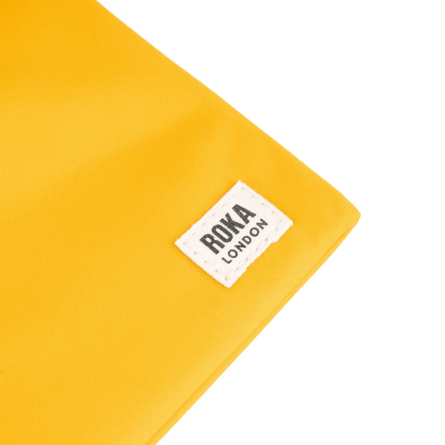 Roka London Chelsea sling taske Saffron XS ultralet