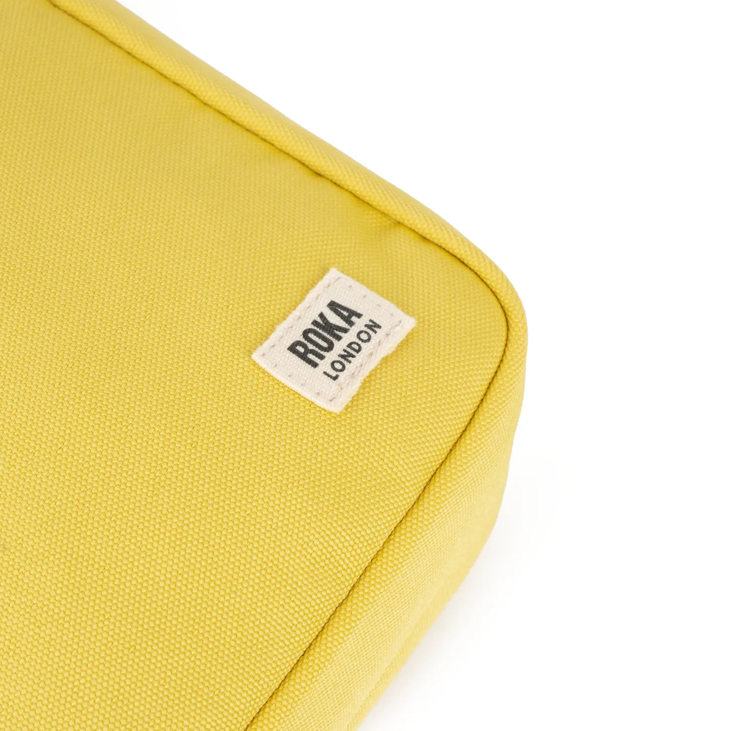 Roka London Bond Pocket crossbody taske Small lemonade vejrbestandig