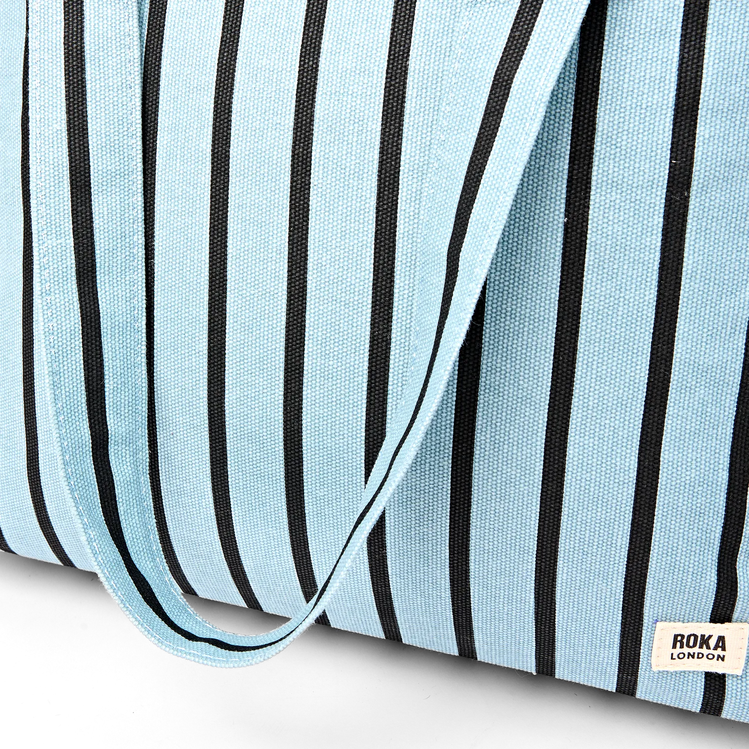 Roka London Sloane Medium skuldertaske blue stripe 24,4 liter