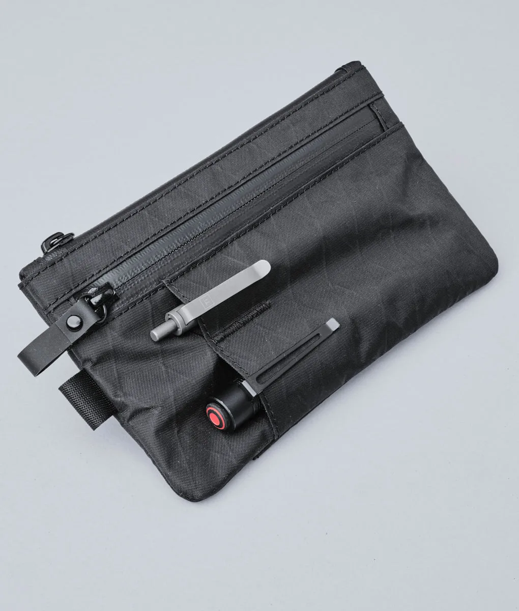 Alpaka Zip Clutch organizer med håndrem