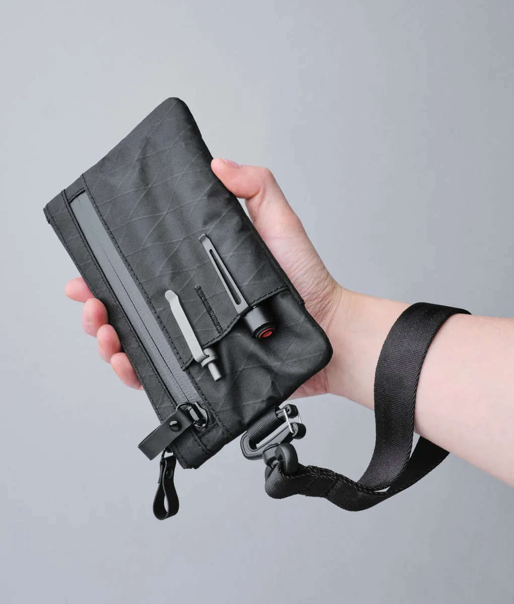 Alpaka Zip Clutch organizer med håndrem