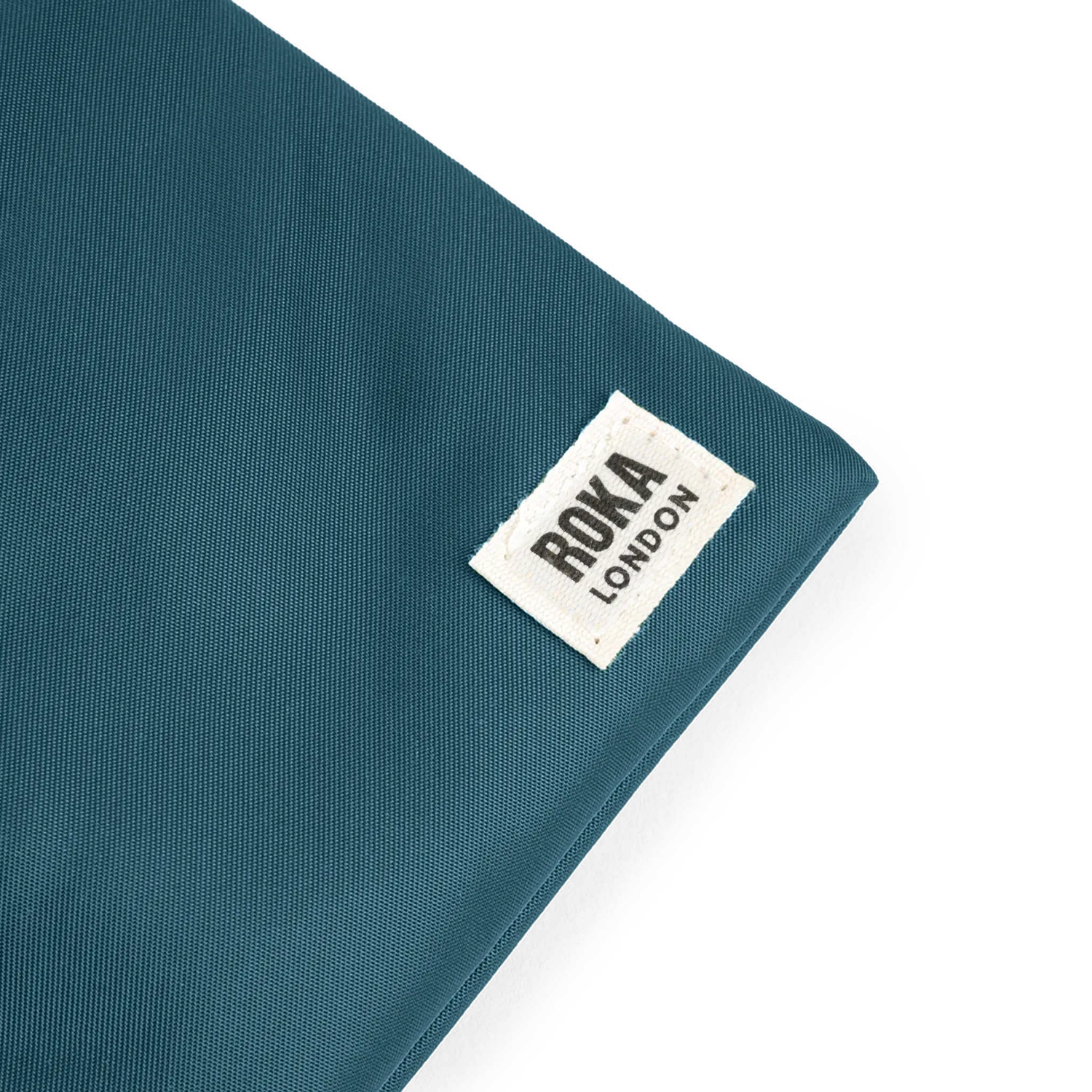 Roka London Chelsea XS sling taske teal 0,3 liter
